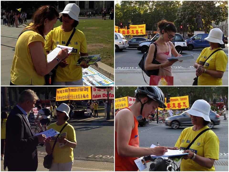 Ljudi potpisuju peticiju podrške miroljubivom otporu Falun Gonga ispred zgrade Britanskog parlamenta.