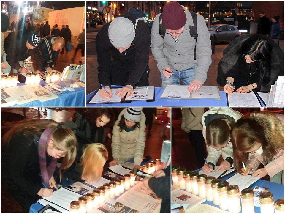 Prolaznici zastaju i potpisuju peticiju kako bi se zaustavio progon Falun Gonga u Kini.